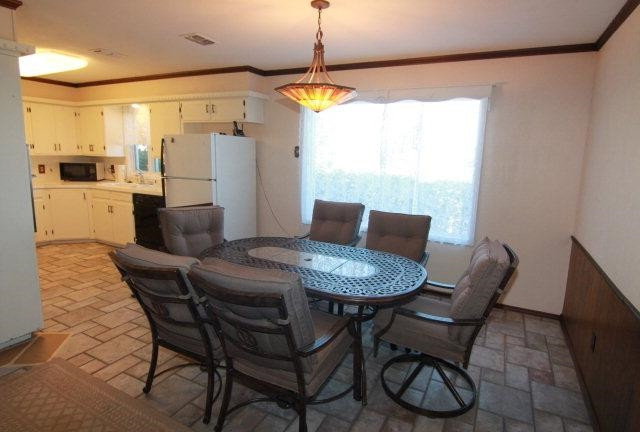 771 U.S. Highway 62 Ralls, TX 79357 - Photo 6 of 10 a view of a dining room with furniture window and wooden floor
