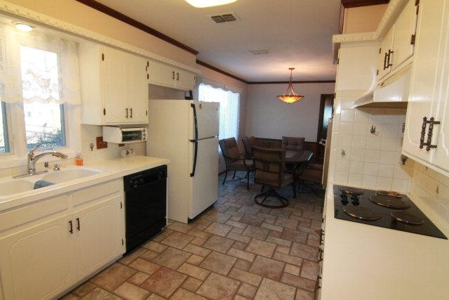 771 U.S. Highway 62 Ralls, TX 79357 - Photo 8 of 10 a kitchen with a sink appliances and cabinets