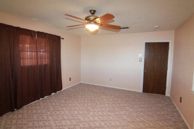 771 U.S. Highway 62 Ralls, TX 79357 - Photo 9 of 10 a view of a chandelier fan and closet in a room