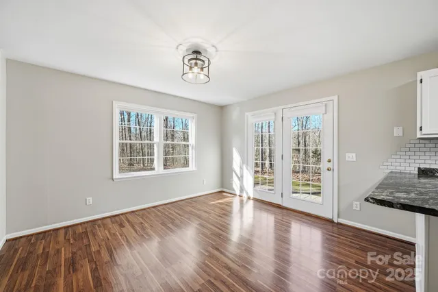 a kitchen with a stove top oven sink and cabinets