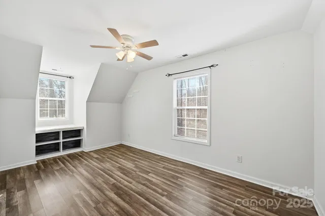 a living room with furniture and a piano