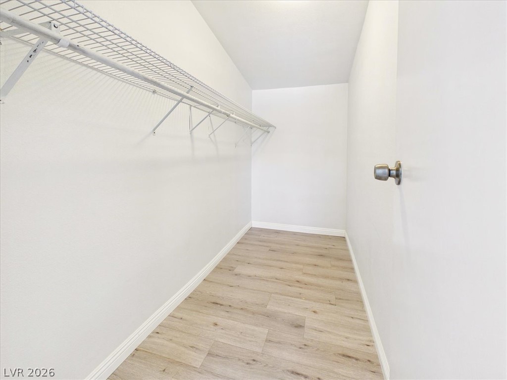 4081 Retread Road Pahrump, NV 89048 - Photo 34 of 98 Ample storage solutions define this practical and organized walk-in closet.