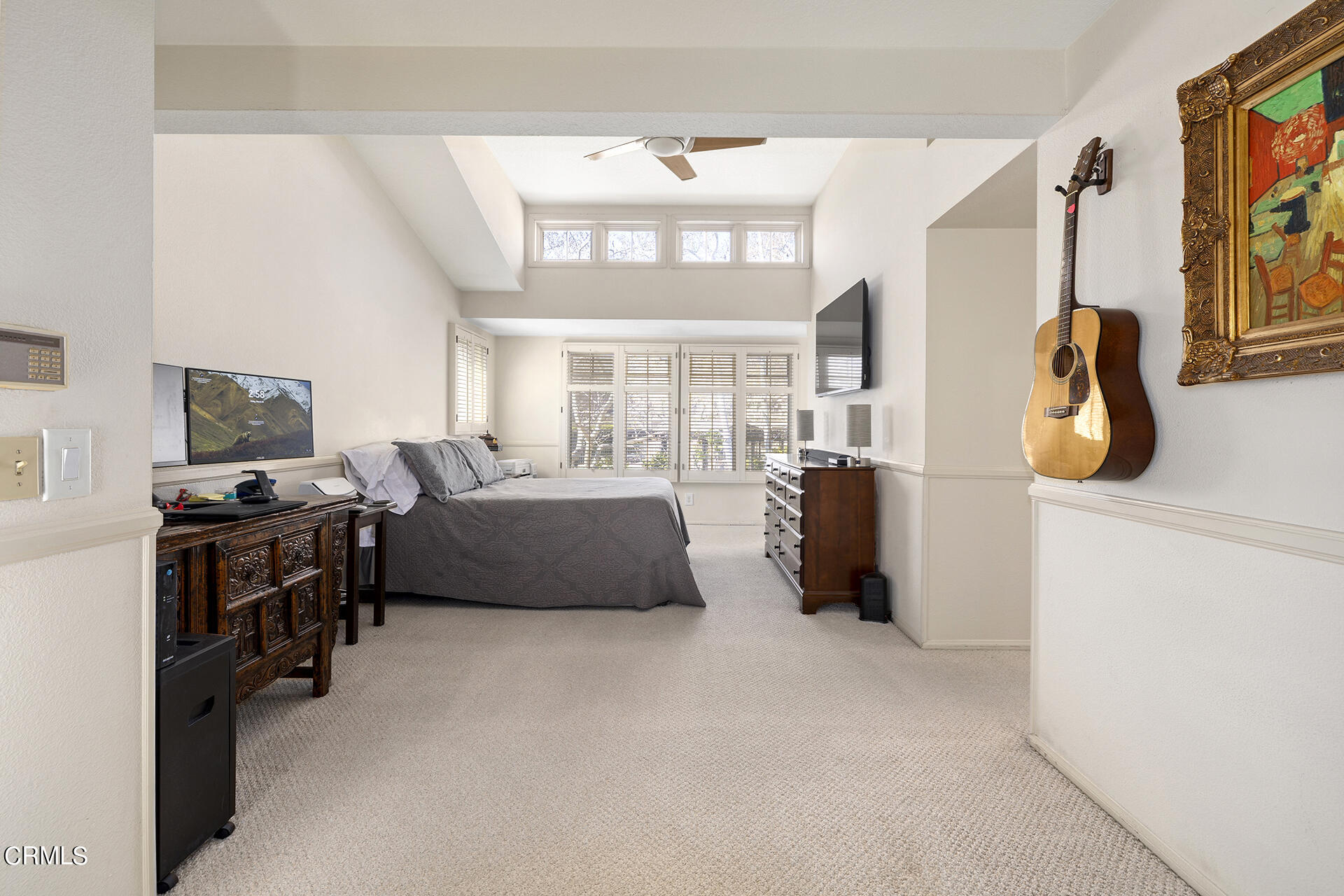 1094 Rocton Drive Pasadena, CA 91107 - Photo 13 of 25 a living room with furniture a flat screen tv and a refrigerator