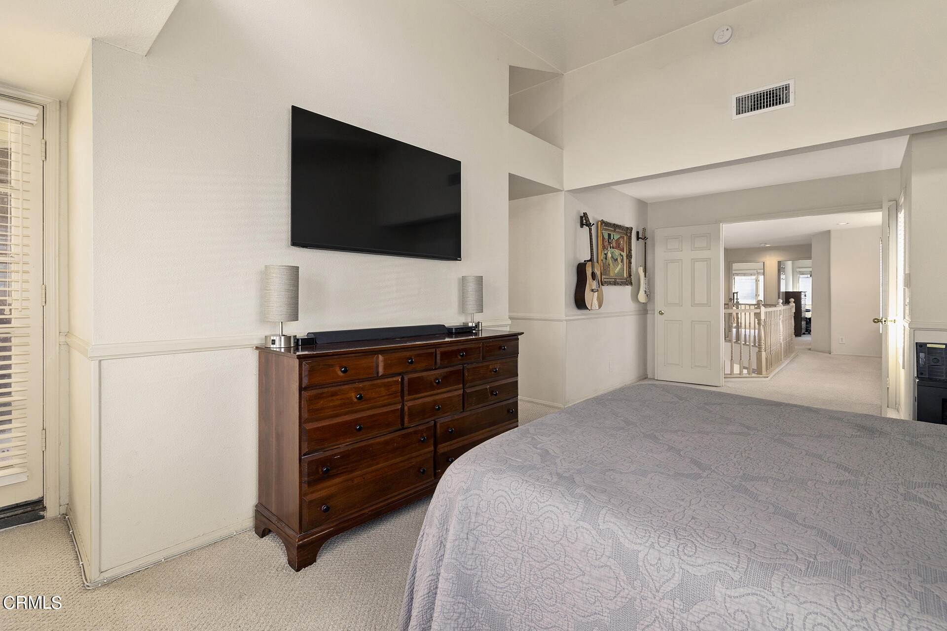 1094 Rocton Drive Pasadena, CA 91107 - Photo 14 of 25 a bedroom with a bed and a flat screen tv