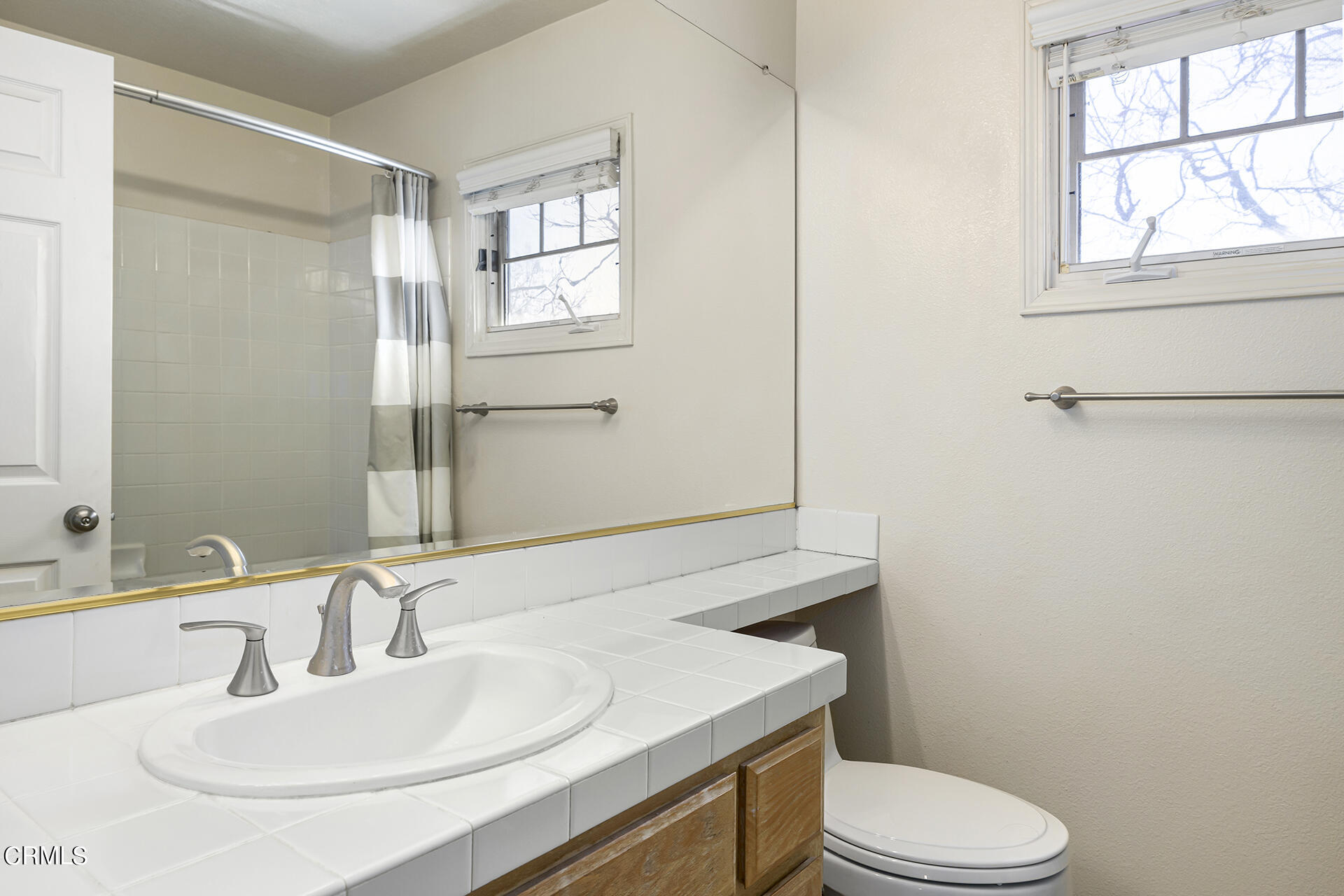 1094 Rocton Drive Pasadena, CA 91107 - Photo 19 of 25 a bathroom with a sink toilet and mirror