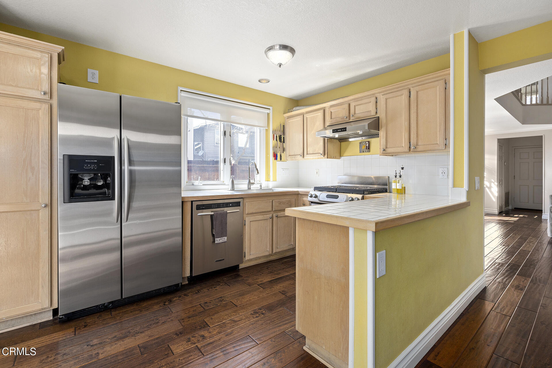 1094 Rocton Drive Pasadena, CA 91107 - Photo 9 of 25 a kitchen with a sink cabinets stainless steel appliances and a window