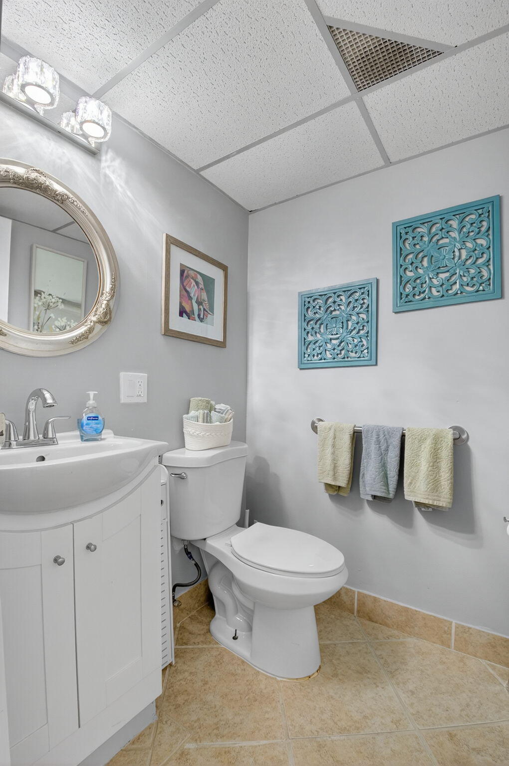 499 Monaco Way, Unit K Delray Beach, FL 33446 - Photo 15 of 33 a bathroom with a toilet sink and mirror