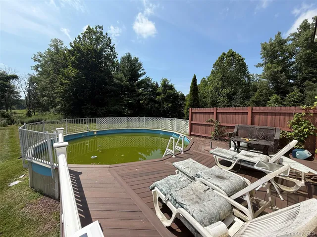 a view of swimming pool with chairs