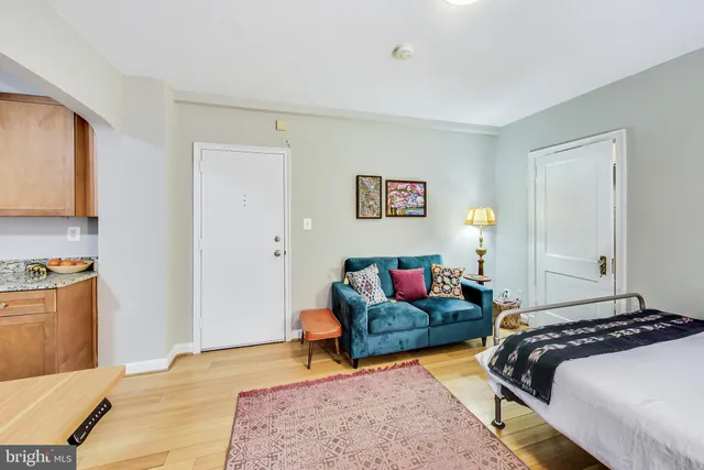 a bedroom with bed and a couch