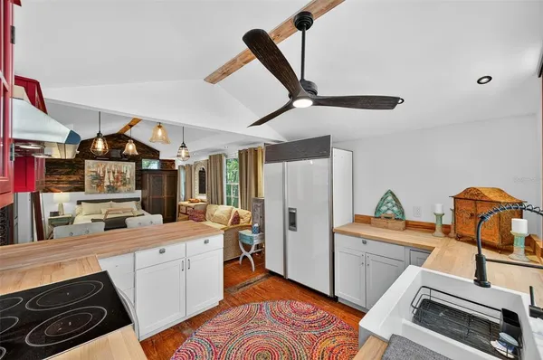 a kitchen that has a sink and a stove