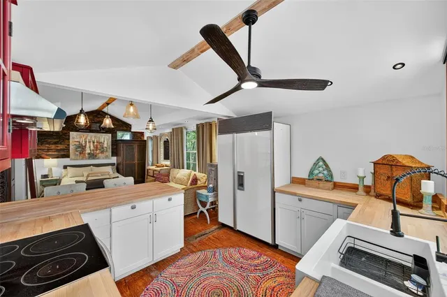 a kitchen that has a sink and a stove