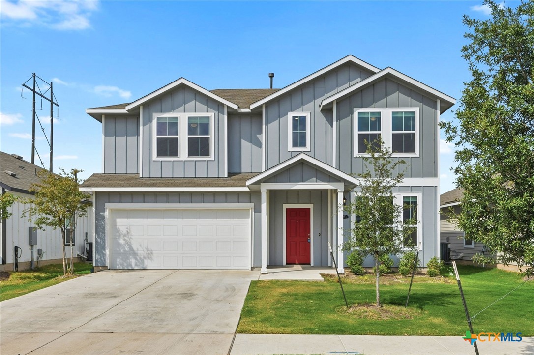 251 Chesterfield Drive Kyle, TX 78640 - Photo 1 of 24 a front view of a house with a yard