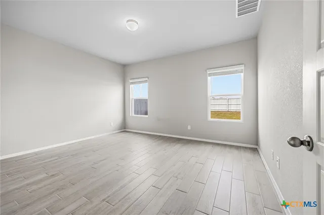 an empty room with windows