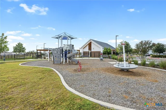 a view of swimming pool with outdoor seating and lake view