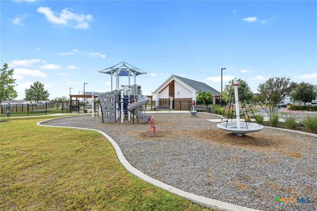 251 Chesterfield Drive Kyle, TX 78640 - Photo 21 of 24 a view of swimming pool with outdoor seating and lake view