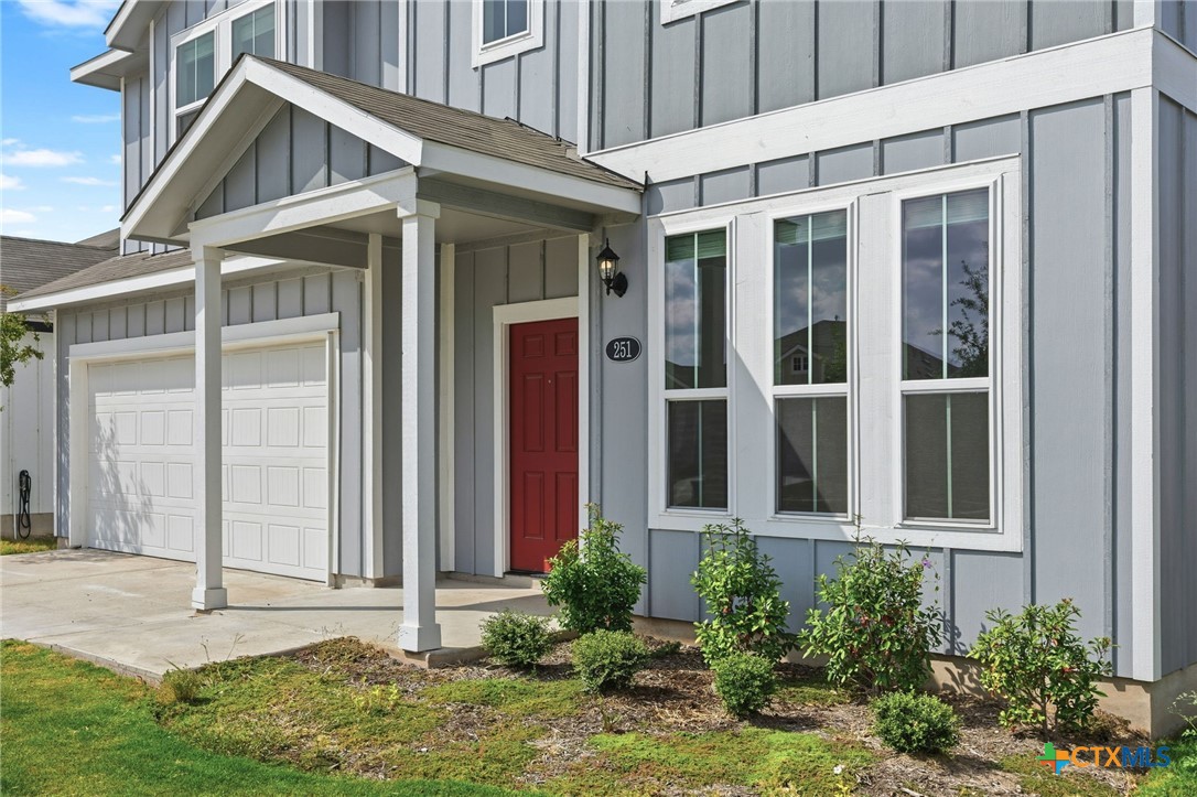 251 Chesterfield Drive Kyle, TX 78640 - Photo 6 of 24 front view of a house with a yard