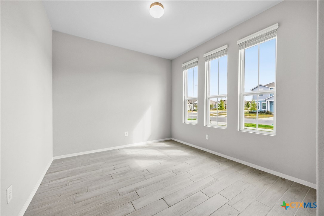 251 Chesterfield Drive Kyle, TX 78640 - Photo 7 of 24 an empty room with windows and closet