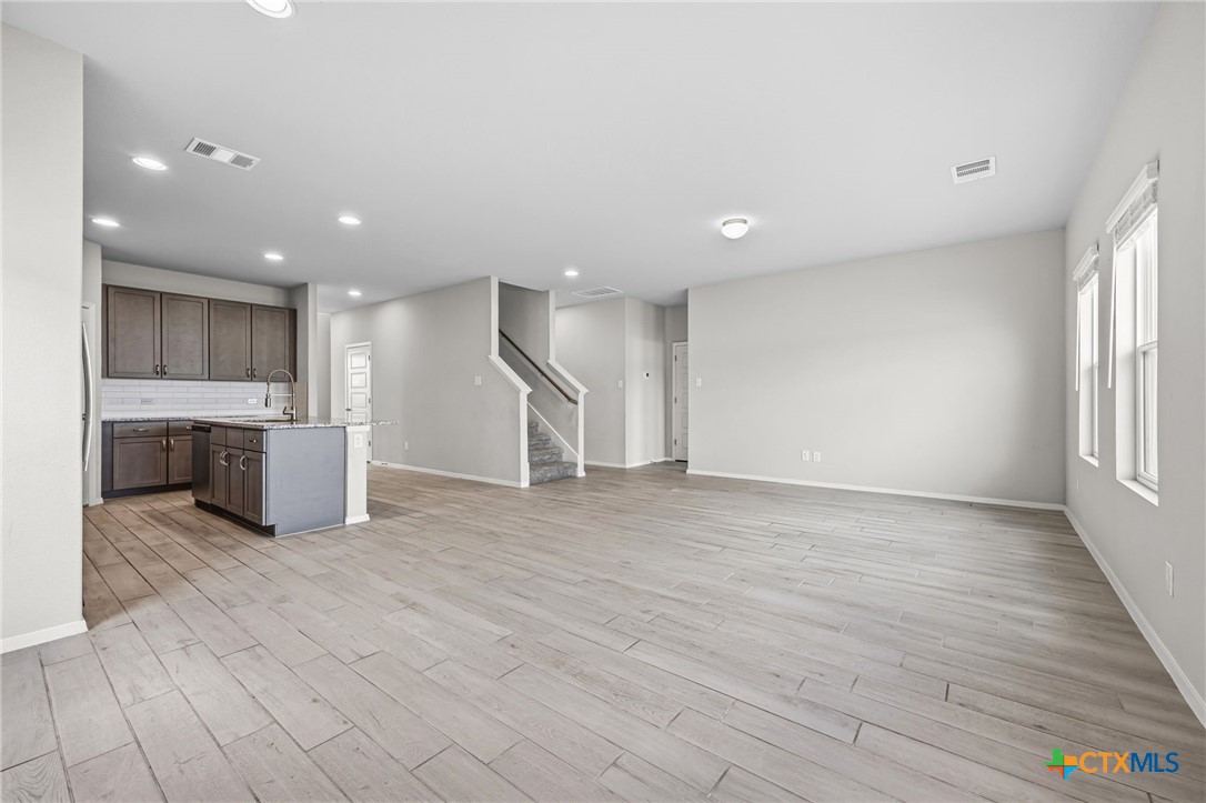 251 Chesterfield Drive Kyle, TX 78640 - Photo 10 of 24 a view of a kitchen with a sink and a window