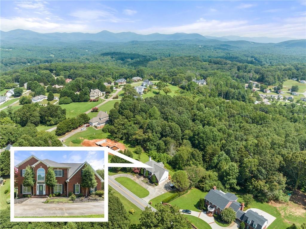 296 Cloudland Road North Dahlonega, GA 30533 - Photo 1 of 1 an aerial view of residential houses with outdoor space and trees