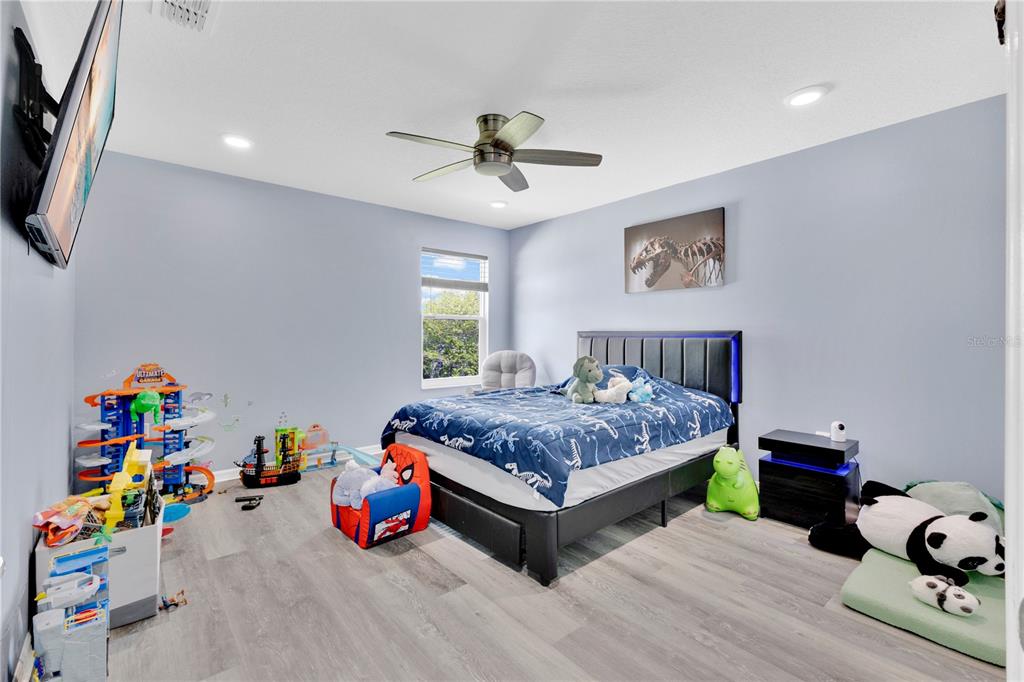 3480 Pawleys Loop North St. Cloud, FL 34769 - Photo 12 of 25 a bedroom with bed and a window