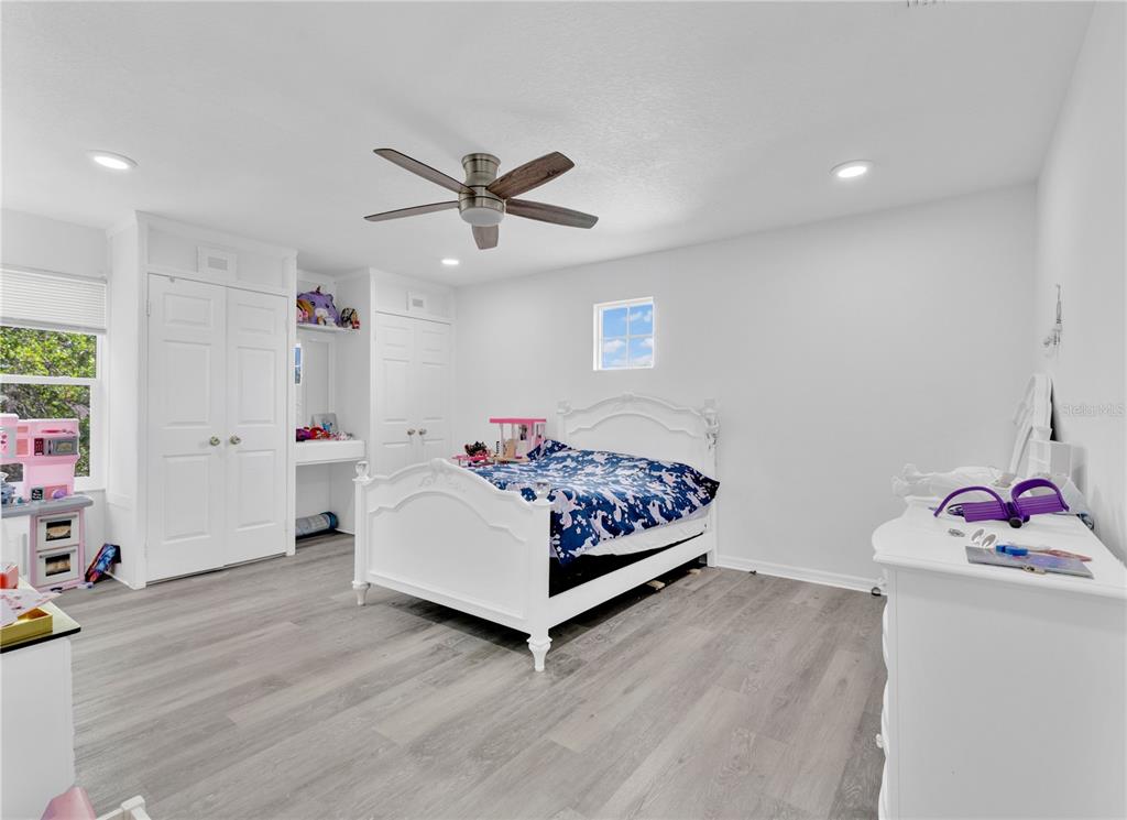 3480 Pawleys Loop North St. Cloud, FL 34769 - Photo 13 of 25 a bedroom with a bed and a window