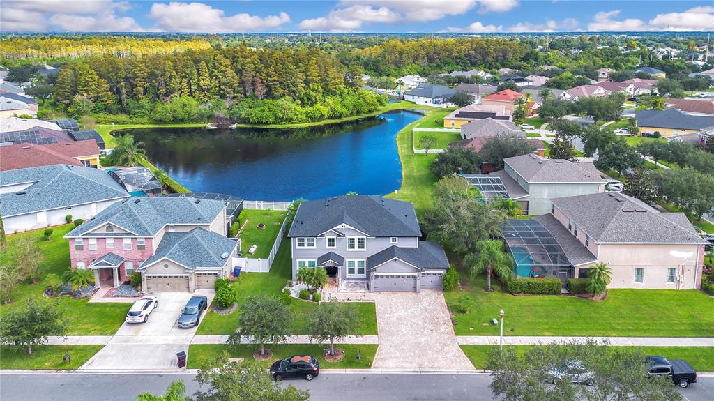 3480 Pawleys Loop North St. Cloud, FL 34769 - Photo 18 of 25 an aerial view of a house with a lake view