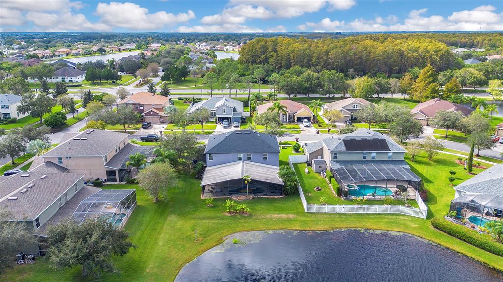 3480 Pawleys Loop North St. Cloud, FL 34769 - Photo 20 of 25 an aerial view of a house with a swimming pool yard and outdoor seating