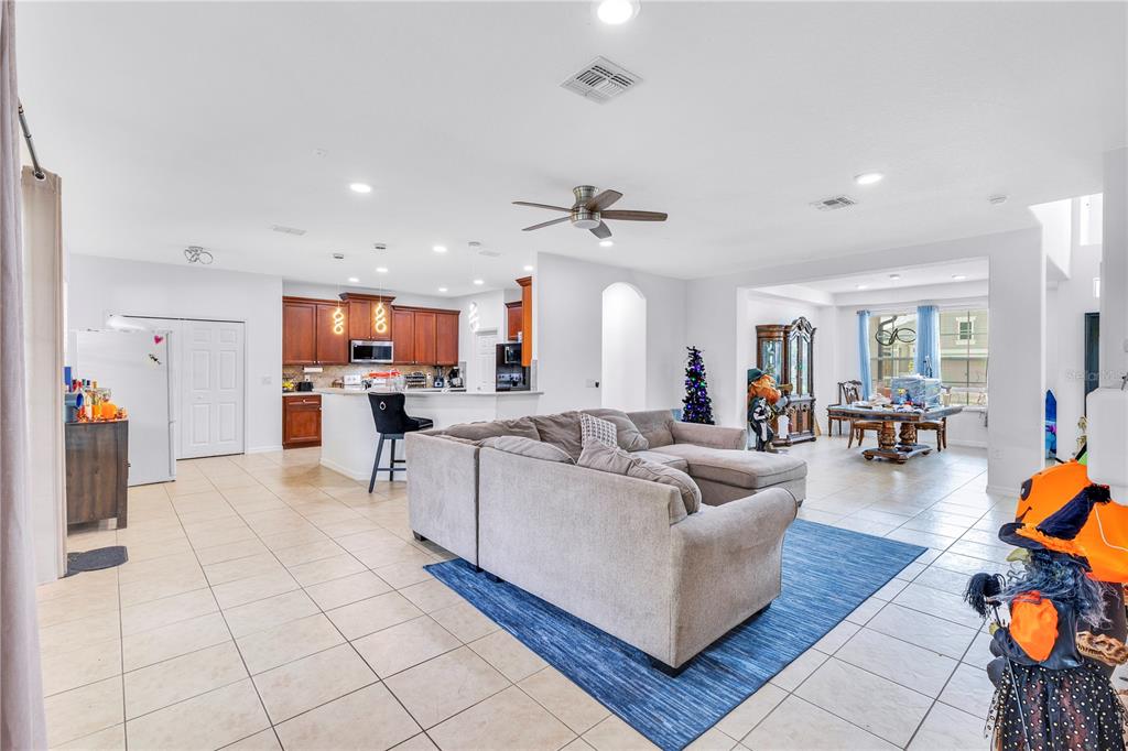 3480 Pawleys Loop North St. Cloud, FL 34769 - Photo 3 of 23 a living room with furniture and kitchen view