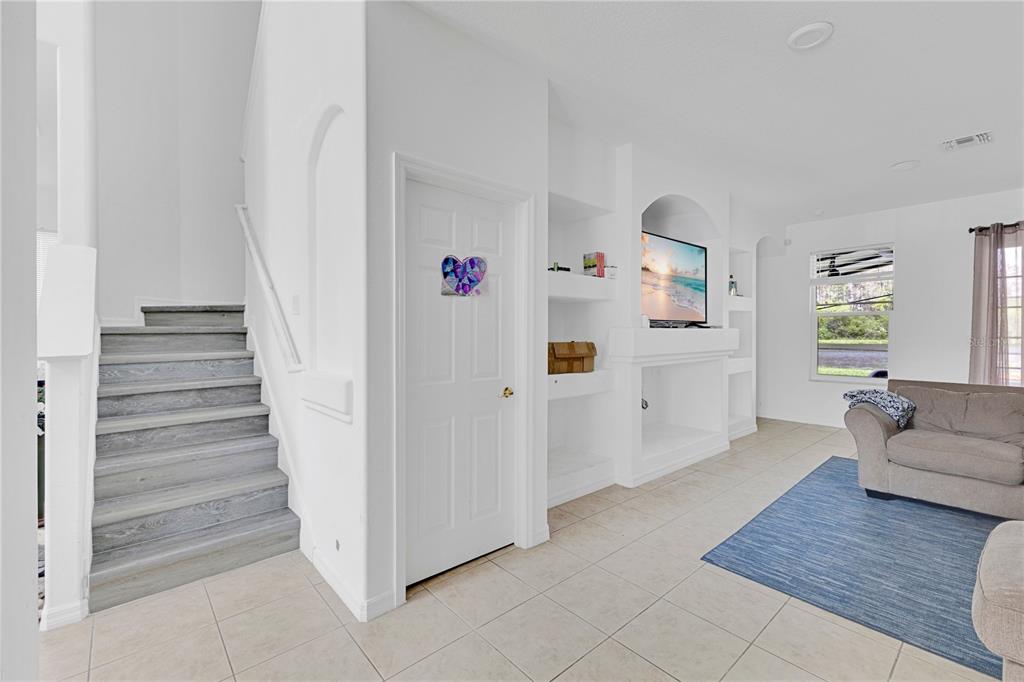 3480 Pawleys Loop North St. Cloud, FL 34769 - Photo 6 of 25 a view of a livingroom with wooden floor and furniture