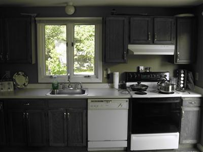 32 Winslows Drive Mashpee, MA 02649 - Photo 4 of 6 a kitchen with a sink a window and cabinets