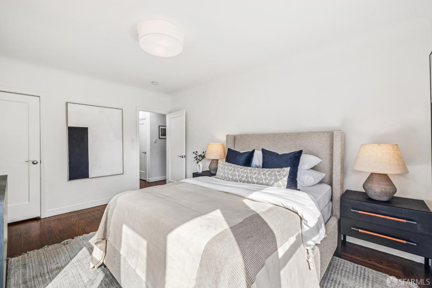 71 Ulloa Street San Francisco, CA 94127 - Photo 15 of 38 a bedroom with a bed and a lamp