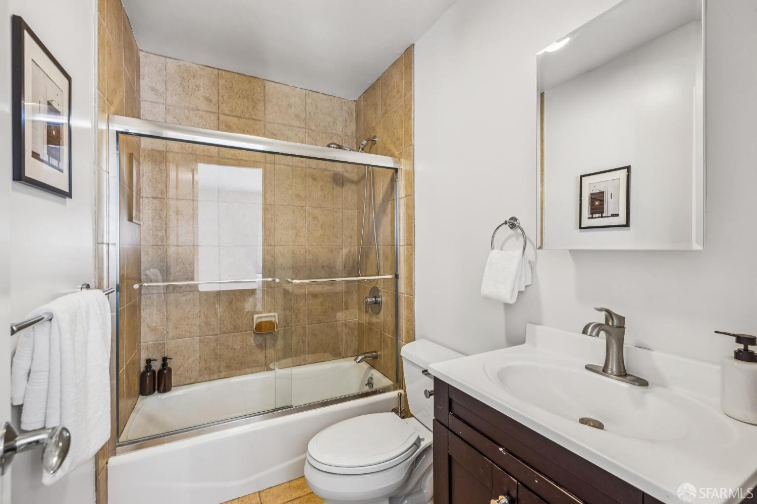 71 Ulloa Street San Francisco, CA 94127 - Photo 29 of 38 a bathroom with a sink a toilet and shower
