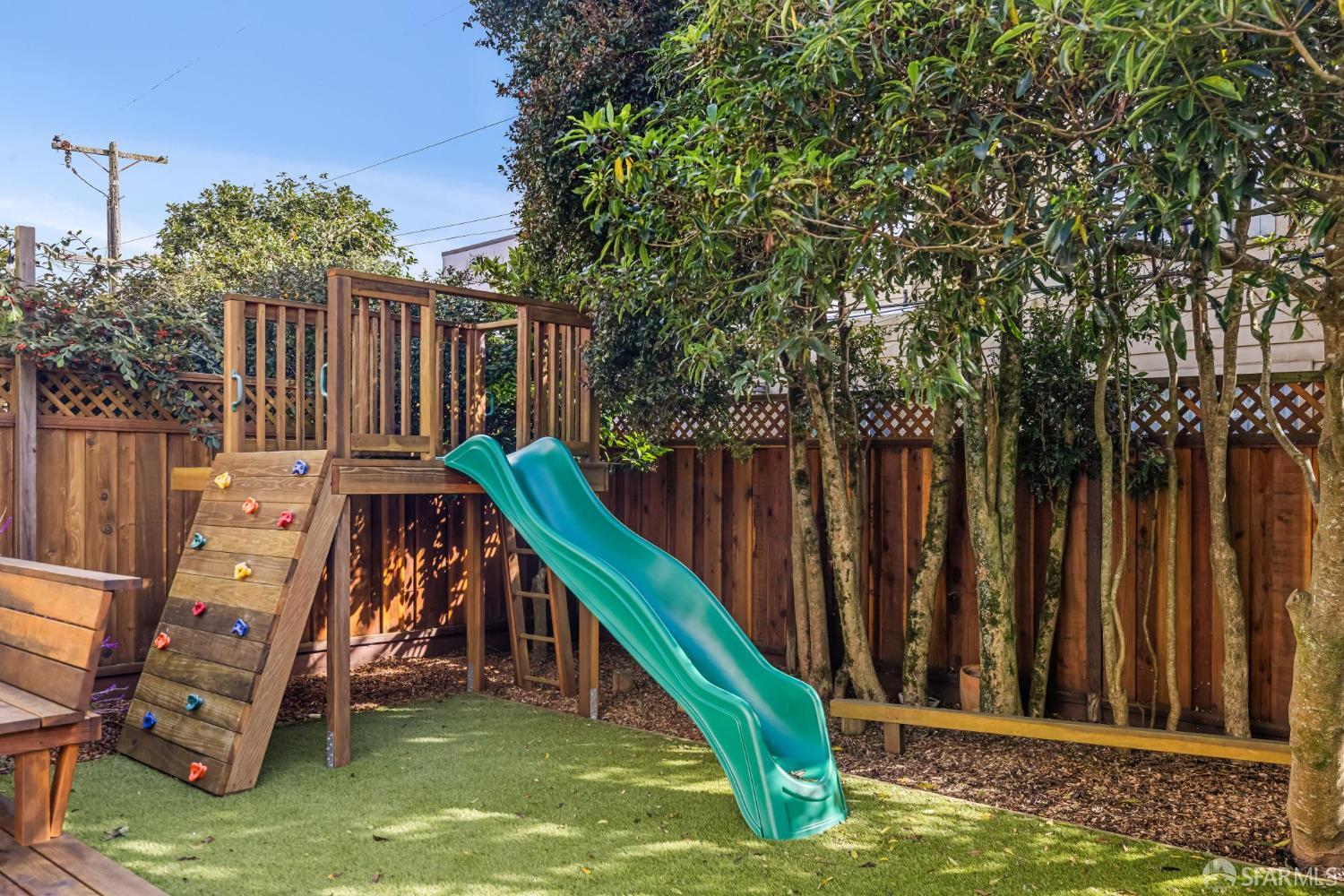 71 Ulloa Street San Francisco, CA 94127 - Photo 35 of 38 a view of a deck with a small yard and wooden fence