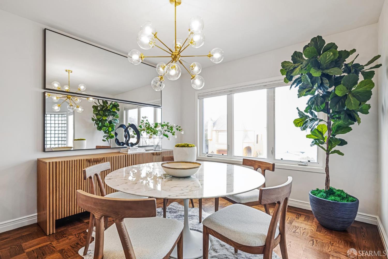 71 Ulloa Street San Francisco, CA 94127 - Photo 8 of 38 a dining room with furniture a large window and a chandelier