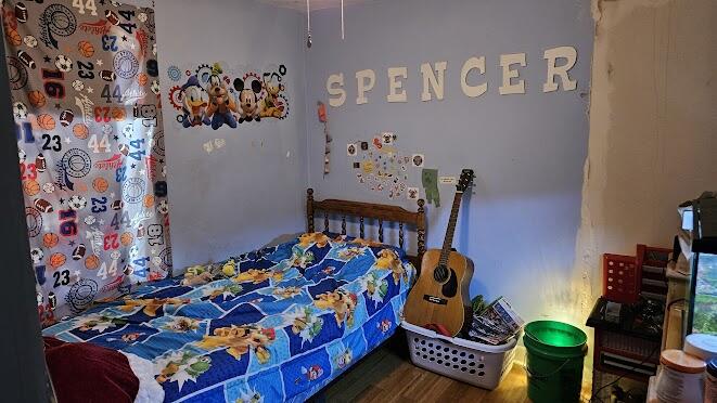 2700 Blake Road Portage, IN 46368 - Photo 7 of 8 a bed sitting in a bedroom next to a window