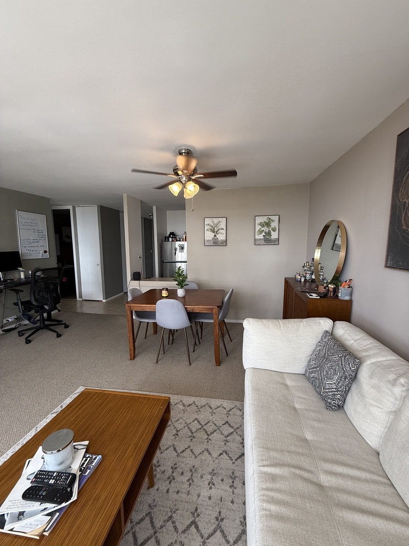 3001 South Michigan Avenue, Unit 2104 Chicago, IL 60616 - Photo 5 of 15 a living room with furniture and a table