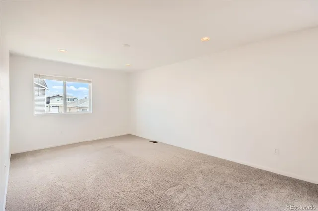 an empty room with a empty space and window