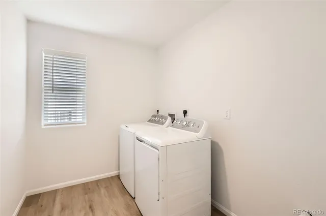 a utility room with a sink dryer and washer