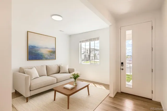 a living room with furniture and a window