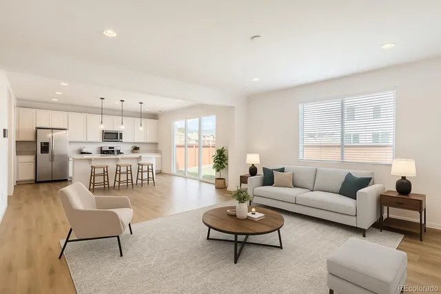 a living room with furniture and a table