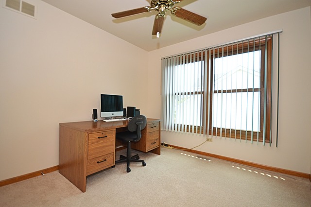 1710 Chestnut Hill Road Plainfield, IL 60586 - Photo 19 of 25 a view of a workspace with furniture and a window