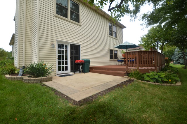 1710 Chestnut Hill Road Plainfield, IL 60586 - Photo 22 of 25 a view of a house with backyard and porch