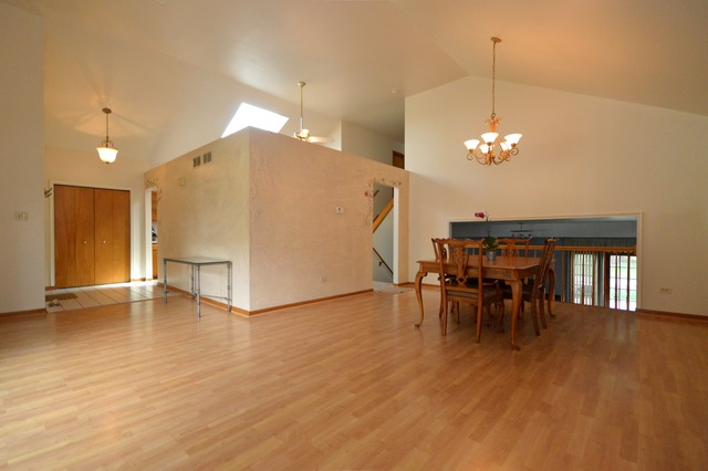 1710 Chestnut Hill Road Plainfield, IL 60586 - Photo 5 of 25 a view of a dining room with furniture and chandelier