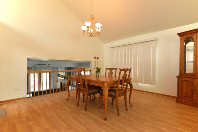 1710 Chestnut Hill Road Plainfield, IL 60586 - Photo 6 of 25 a view of a dining room with furniture and chandelier