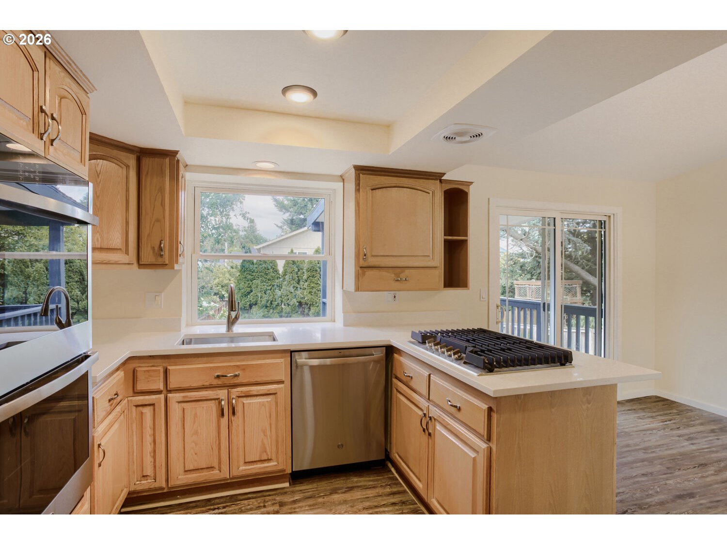 14539 Southeast Center Street Portland, OR 97236 - Photo 10 of 30 a kitchen that has a sink and a stove