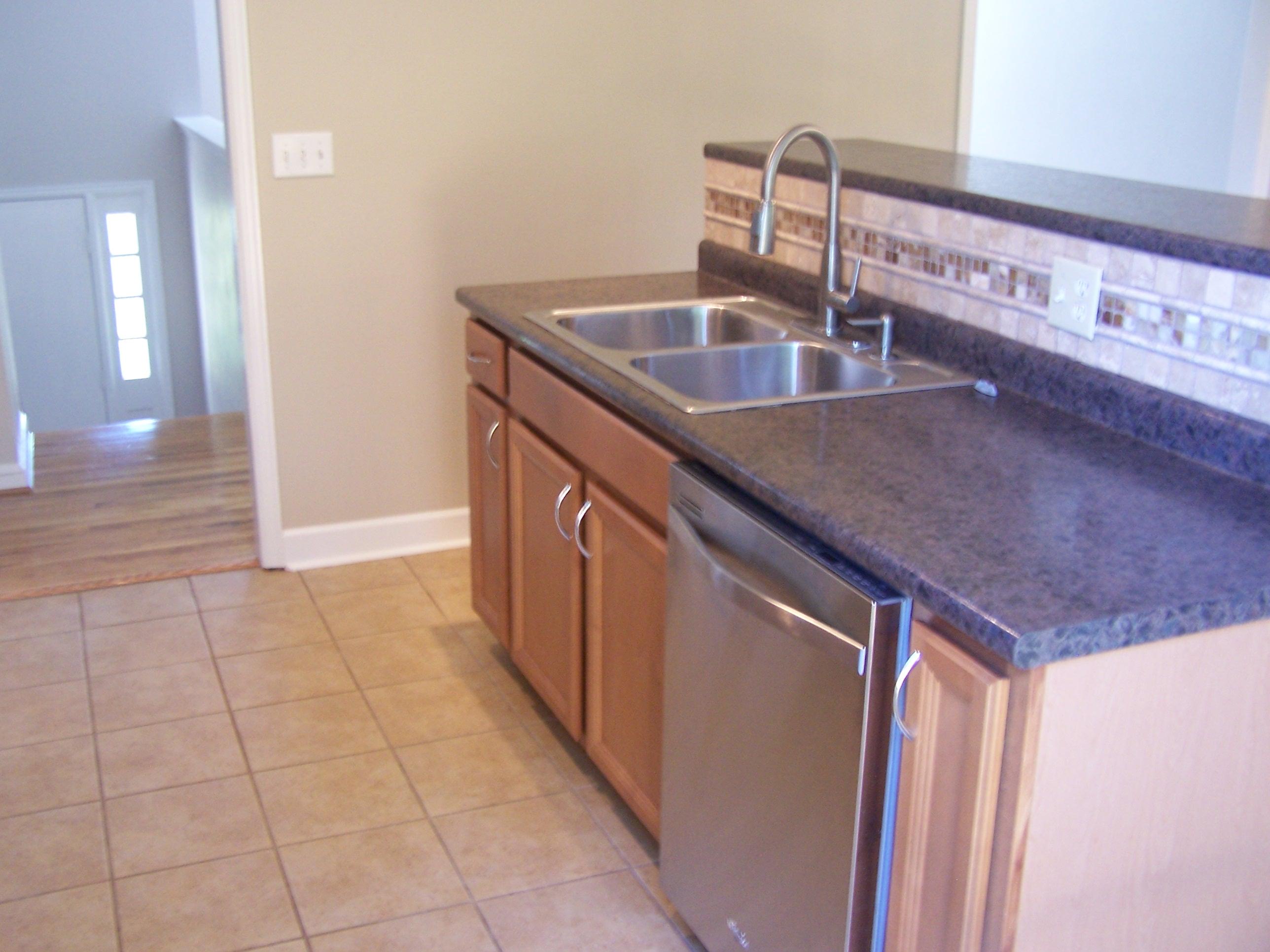 300 Ridge Drive Goodview, VA 24095 - Photo 7 of 19 a kitchen with a sink a counter top space and cabinets