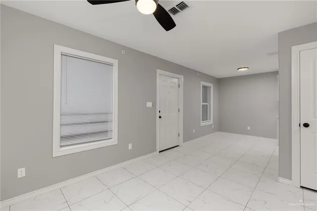 a view of an empty room and window