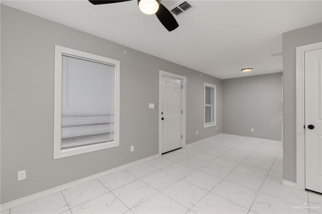1426 East Rogers Road, Unit 52 Edinburg, TX 78542 - Photo 2 of 13 a view of an empty room and window
