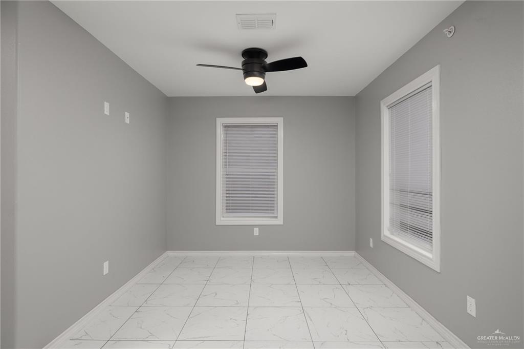1426 East Rogers Road, Unit 52 Edinburg, TX 78542 - Photo 3 of 13 a view of an empty room with a window