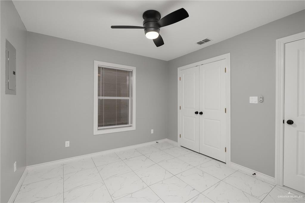 1426 East Rogers Road, Unit 52 Edinburg, TX 78542 - Photo 6 of 13 a view of an empty room with a window